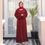 woman with cherry maroon abaya dress